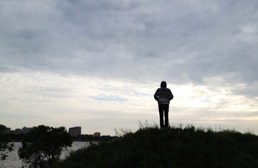 Fototapeta na wymiar man standing on hill