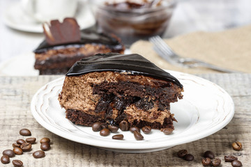 Piece of chocolate cake on wooden table