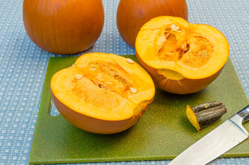 Pumpkins cut in half to extract the seeds