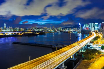 Raamstickers Hong Kong city with highway at night © leungchopan