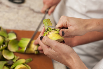 Gourmet chef preparing artichoke hearts