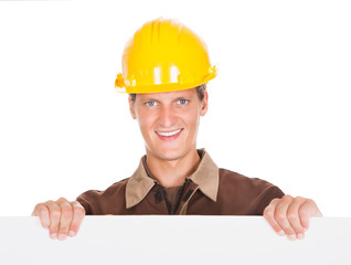 Male Mechanic Holding Blank Placard