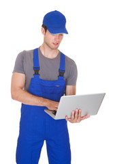 Mechanic Holding Laptop