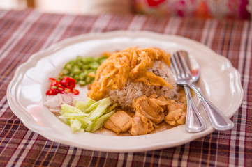Spicy rice with chicken, eggs, pepper salad