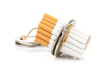Addition concept with cigarettes and handcuffs