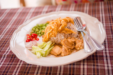 Spicy rice with chicken, eggs, pepper salad