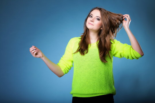 Attractive girl in bright vivid colour sweater
