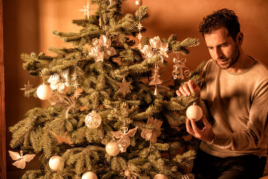 Man Decorating the Christmas Tree
