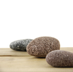 Fototapeta na wymiar stones on a wood board