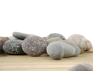 Fototapeta na wymiar Set of three stones on wooden board
