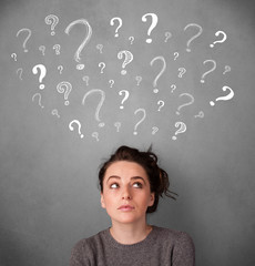 Young woman with question marks above her head