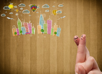 Happy smiley fingers looking at colorful handrawn cityscape