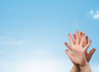 Happy smiley fingers looking at clear blue sky copyspace