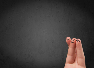 Happy finger smileys with empty copy space dark background