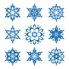 Fototapeta na wymiar Set of ornamental snowflakes isolated on white