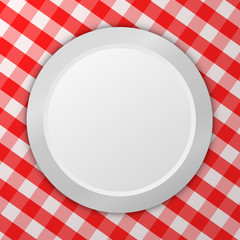 Empty plate on tablecloth