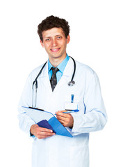 Portrait of smiling young male doctor writing on a patient's med