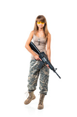 Soldier young beautiful girl dressed in a camouflage with a gun