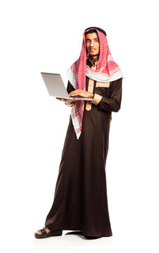 Young smiling arab with laptop isolated on white