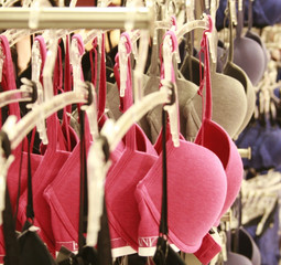 Row of bras hanging in lingerie store