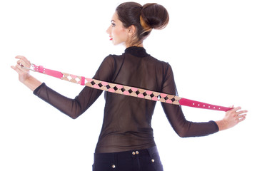 Portrait of a young brunette woman in designer clothes