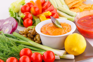 Vegetables, olives, nachos, red and cheese sause