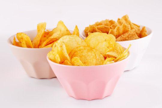 Potato and wheat chips in bowls