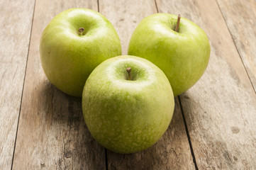 green apple on wooden background