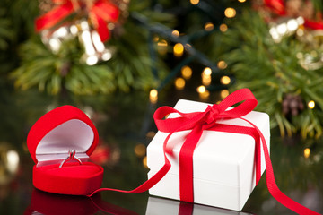Engagement Ring in Box and Luxury present in red ribbon
