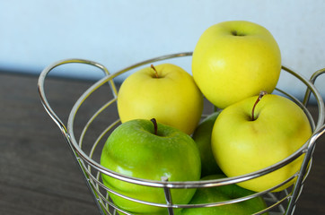 Green and Yellow Apples in Basket