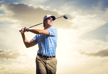 Golfer at sunset