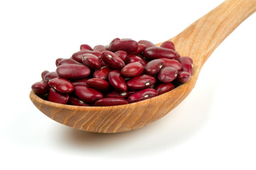 dried red beans in a spoon isolated on white background