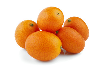 Sweet kumquat citrus fruits closeup on white