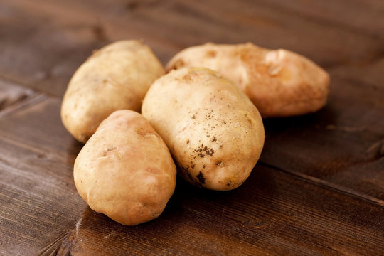 Homegrown potatoes on vintage table