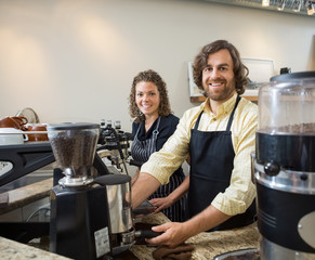 Colleagues Working In Coffeeshop