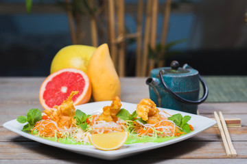 Fried breaded shrimp served with lettuce.