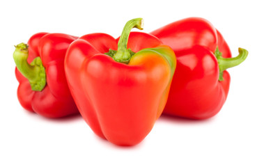 Three red sweet peppers
