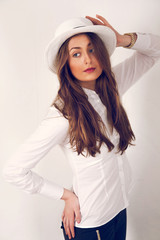 Fototapeta premium girl posing with a hat