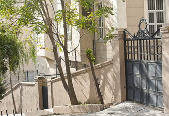 Exterior wall of an apartment building with gate