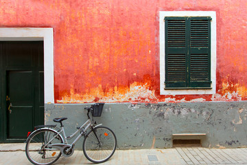 Fototapeta na wymiar Menorca Ciutadella red grunge facade texture