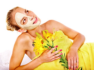 Woman with facial mask.