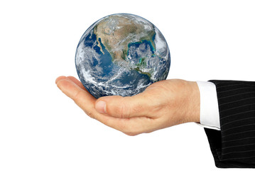 Planet Earth in the palm of isolated on a white background.