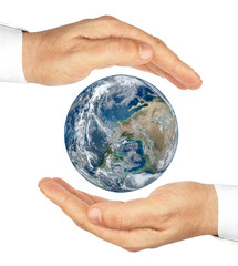 Hands holding the planet Earth isolated on a white background.