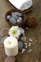 Fototapeta na wymiar Aromatic spa set with candle ,stones, flower