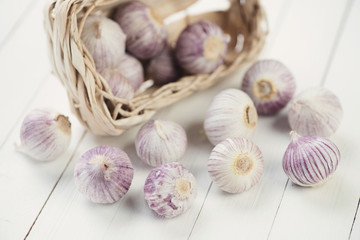 Chinese solo garlic in a wicker basket, studio shot
