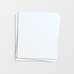pile paper on a gray background.stationery.blank sheets of paper