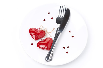 table setting for Valentine's Day with fork, knife and hearts