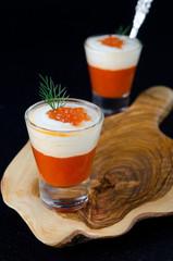two appetizers of sweet pepper, cream and red caviar in a glass