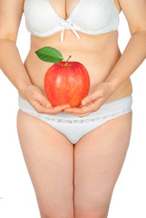 Fat woman with an red apple