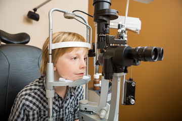 Boy Undergoing Eye Examination With Slit Lamp